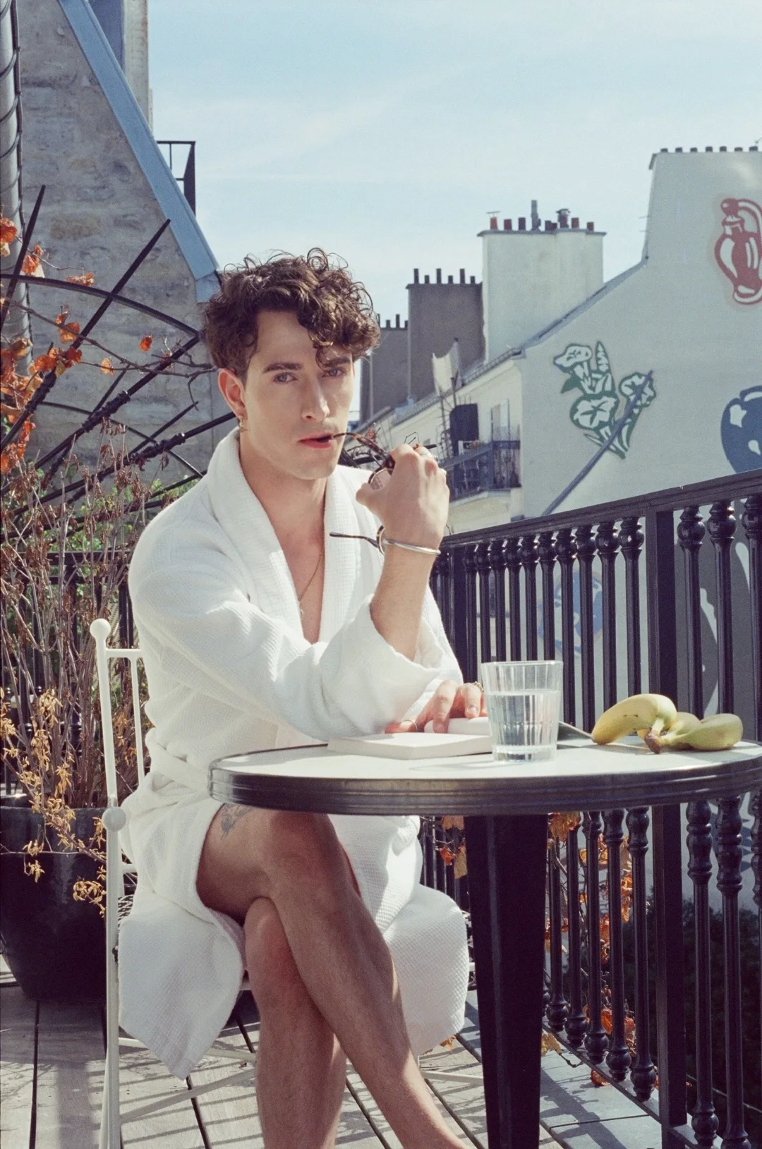 Breakfast on a Paris rooftop — Jules Sauvage, gay male escort Paris, in a white bathrobe